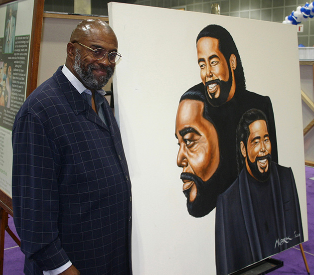 The artist Mubarak displaying his work at Black Business Expo