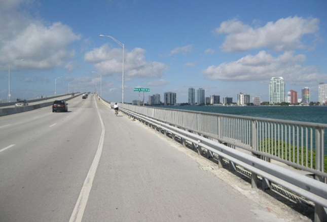 Biking over Rickenbacker Bridge in Miami, Winter Cycling Vacations