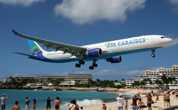 Air Caraibes jet landing at St. Maarten Transportation