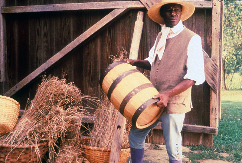 Worker-actor demonstrating life in Old Salem; Winston-Salem History